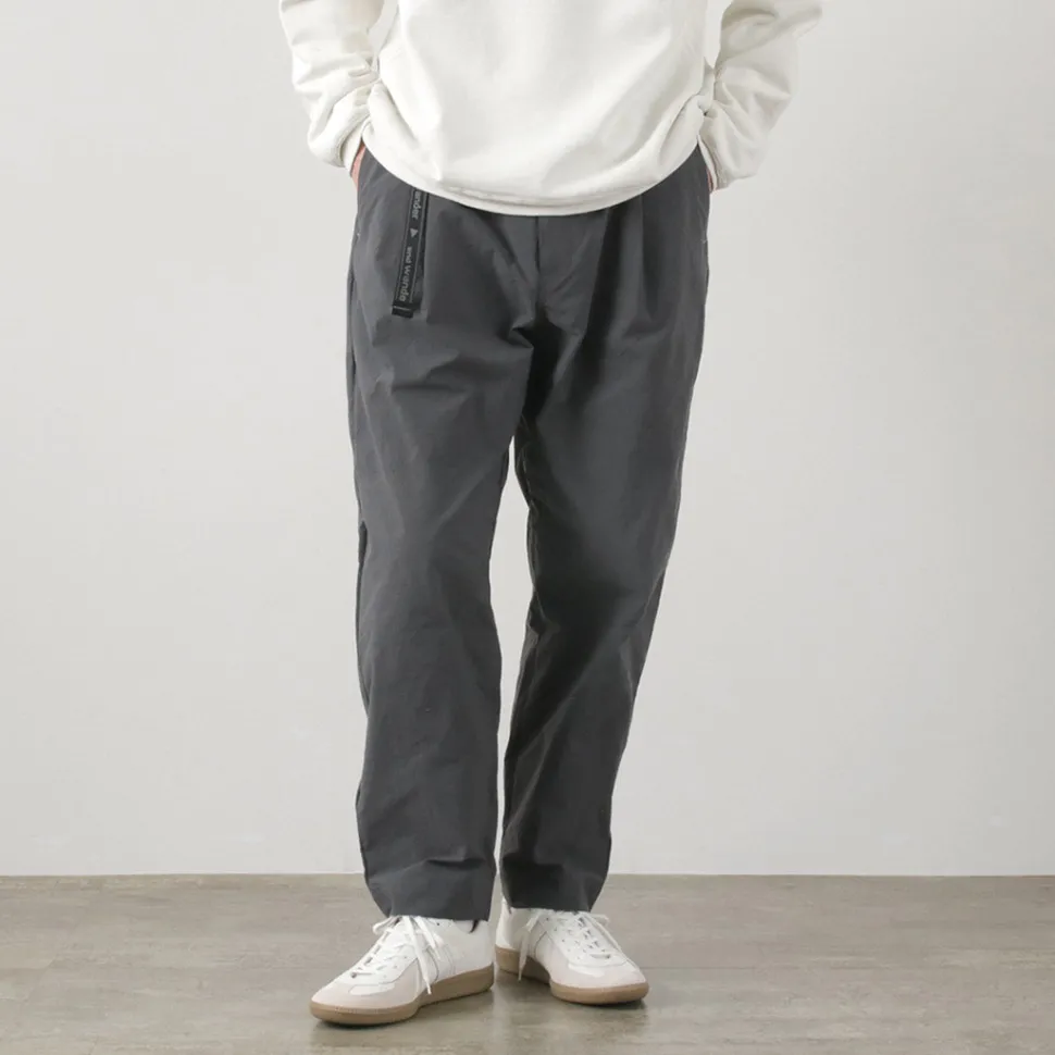 AND WANDER / Nylon Chino Tucked Tapered Pants